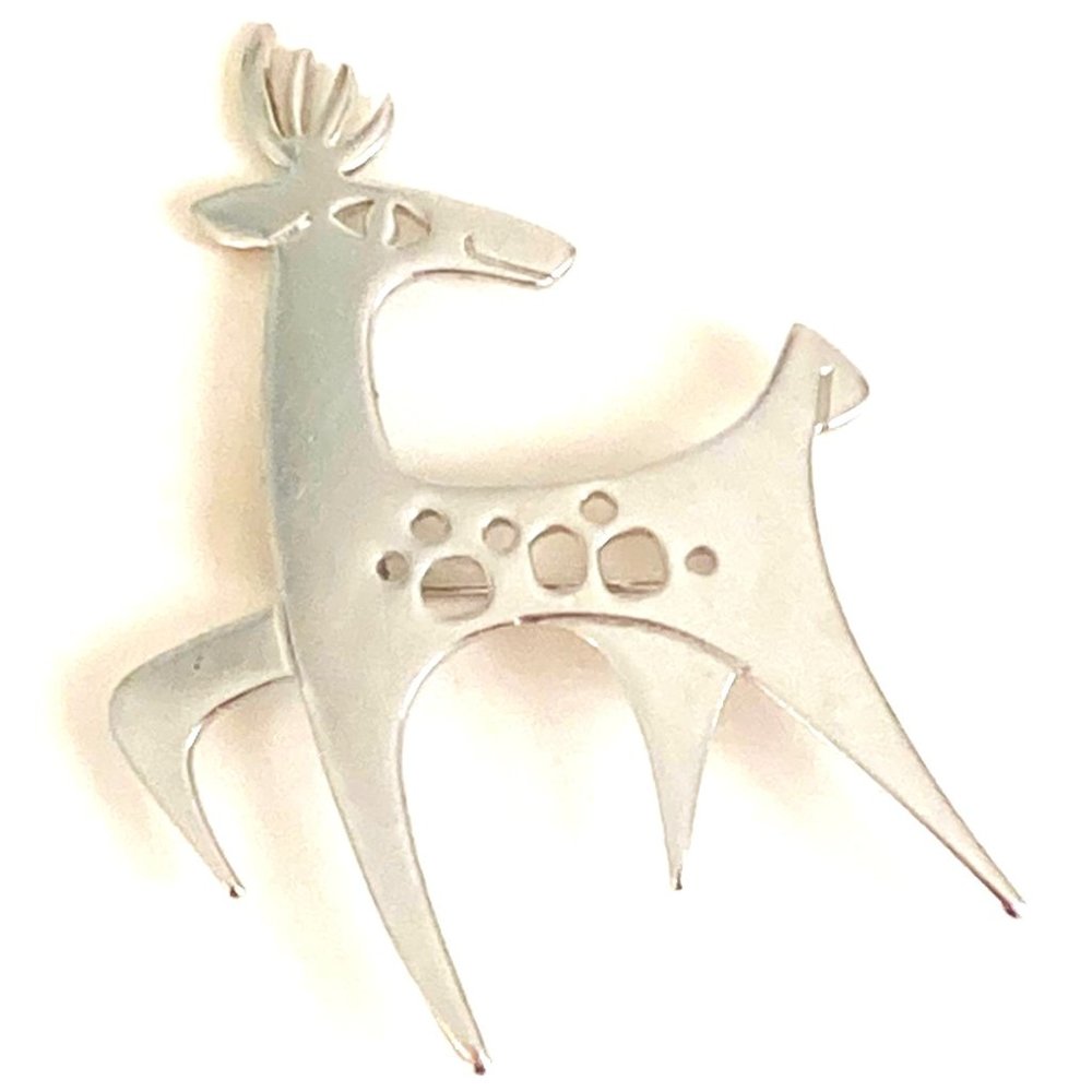 Jaunty midcentury figural brooch signed C&M